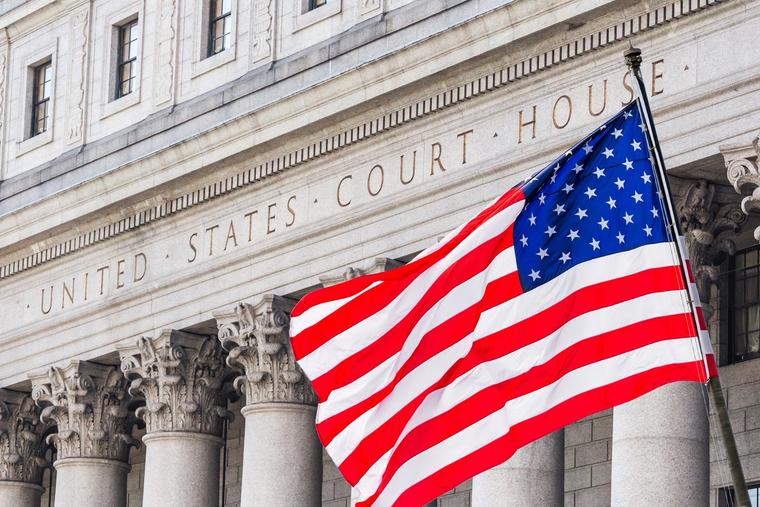 A U.S. flag flies in front of the Thurgood Marshall United States Courthouse in New York City.